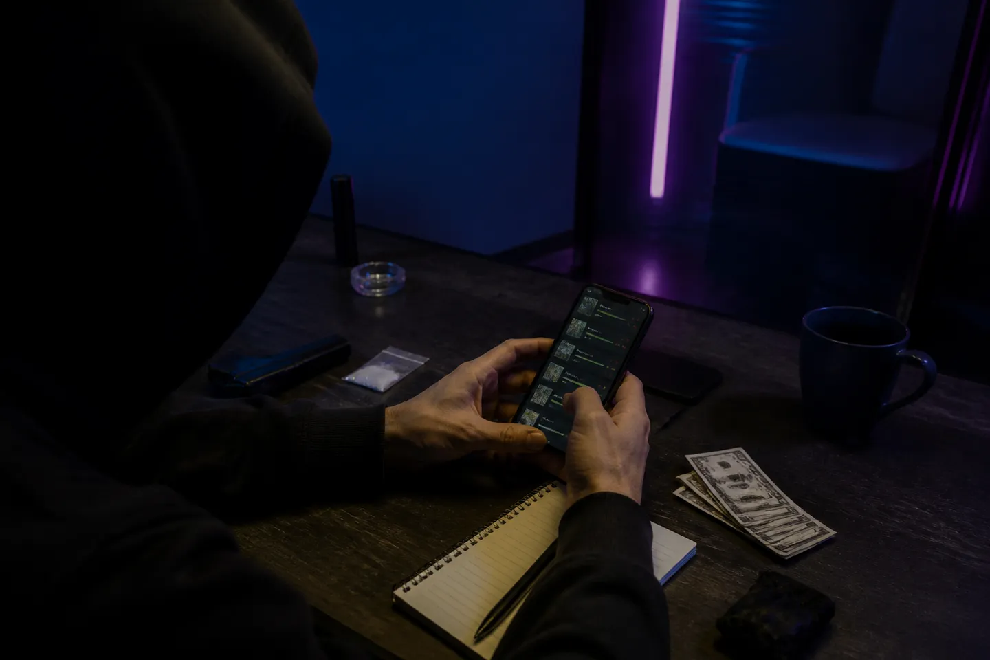 person examining darknet vendor ratings on smartphone